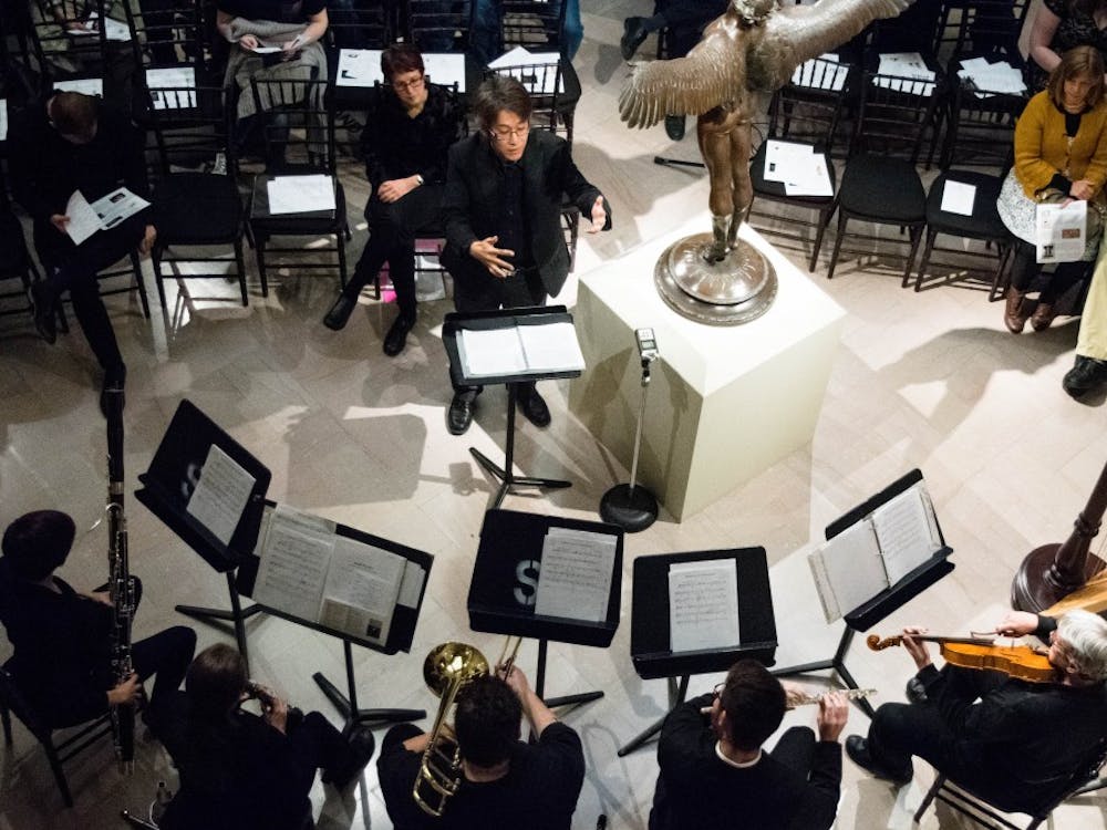 Chin Ting Chan, musical director for The New Music Ensemble, conducts Nov. 1, 2017 at The David Owsley Museum for a performance. The School of Music played a concert with pieces inspired by artwork from the museum. Rachel Ellis, DN File