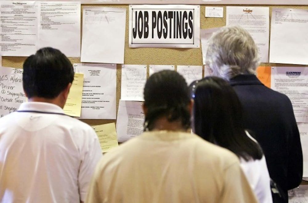  Job seekers check out openings posted on a small bulletin board at the Arlington Convention Center in Arlington, Texas, on Wednesday, September 7, 2005. The government predicts a total of 15.3 million new jobs will be created by 2018. MCT PHOTO