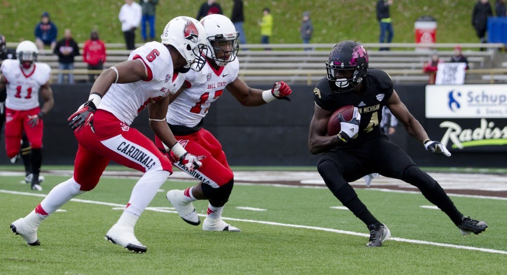 Seniors Jeffery Garrett and Kenneth Lee prepare to tackle a Western Michigan player on Oct. 19 at Waldo Stadium. DN PHOTO BREANNA DAUGHERTY