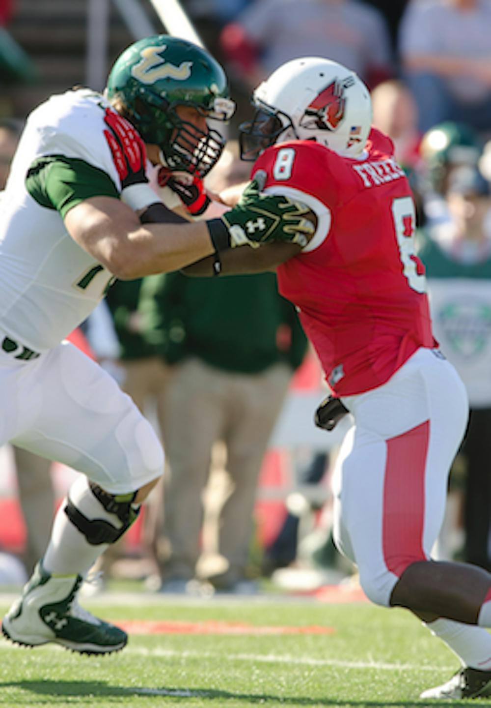 DN FILE PHOTO COREY OHLENKAMP Linebacker Travis Freeman slams into a South Florida offense player at the start of the game against South Florida on Sept. 22. Freeman, along with others on the football team, have said they will not settle for another 6-6, because they want to get into a bowl game. 