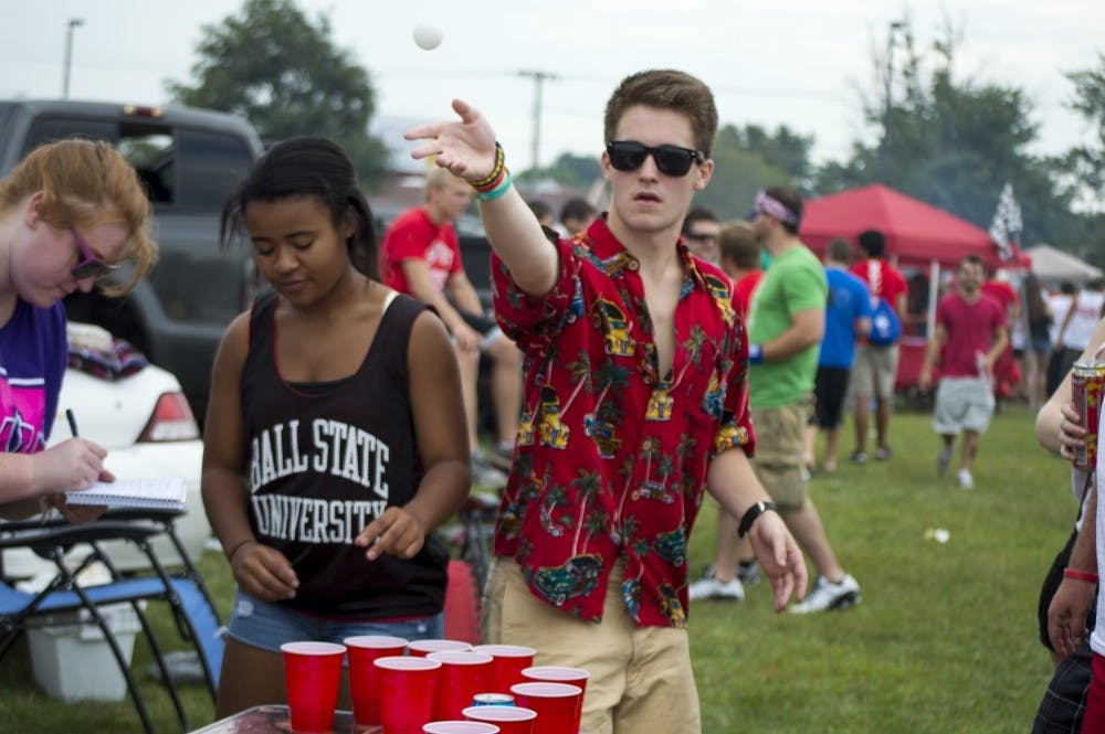 <p>Students partake in a game of beer pong at tailgate activities. DN FILE PHOTO ALAINA JAYE HALSEY.</p>