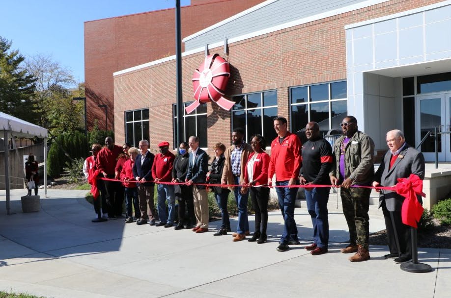 Members of the Ball State community, including President Geoffrey Mearns, get ready to cut the ribbon at the Multicultural Center Oct. 23. The new Multicultural Center is located next to Bracken Library. Shwetha Sundarrajan, DN