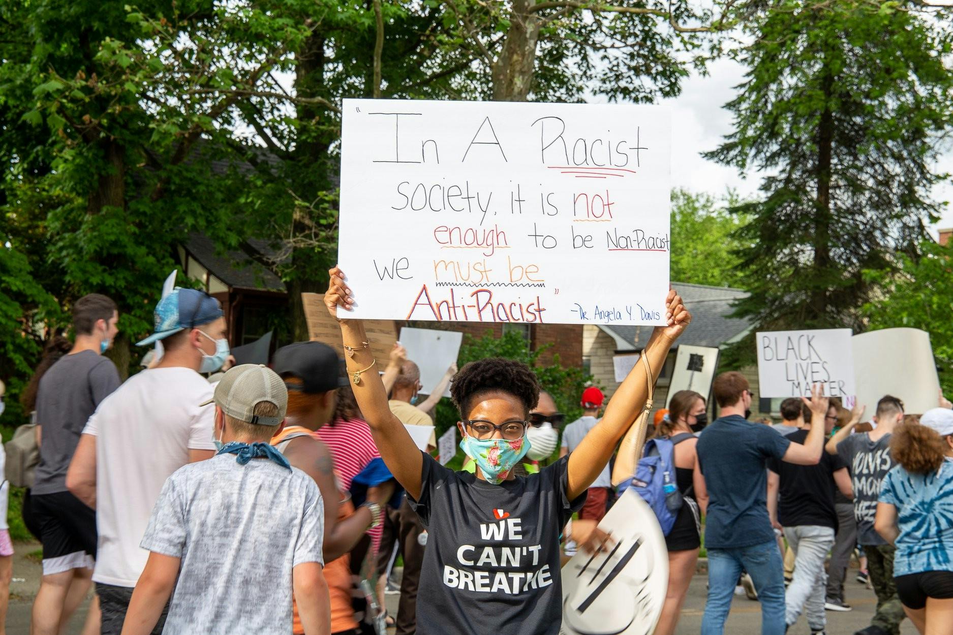 Nykasia Williams holds up a sign during a protest. Nykasia Williams, Photo Provided