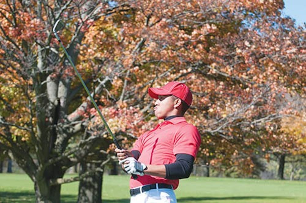James Blackwell takes his shot at the Delaware Country Club in Muncie, during the Earl Yestingsmeier Invitational on Oct. 16.  The men