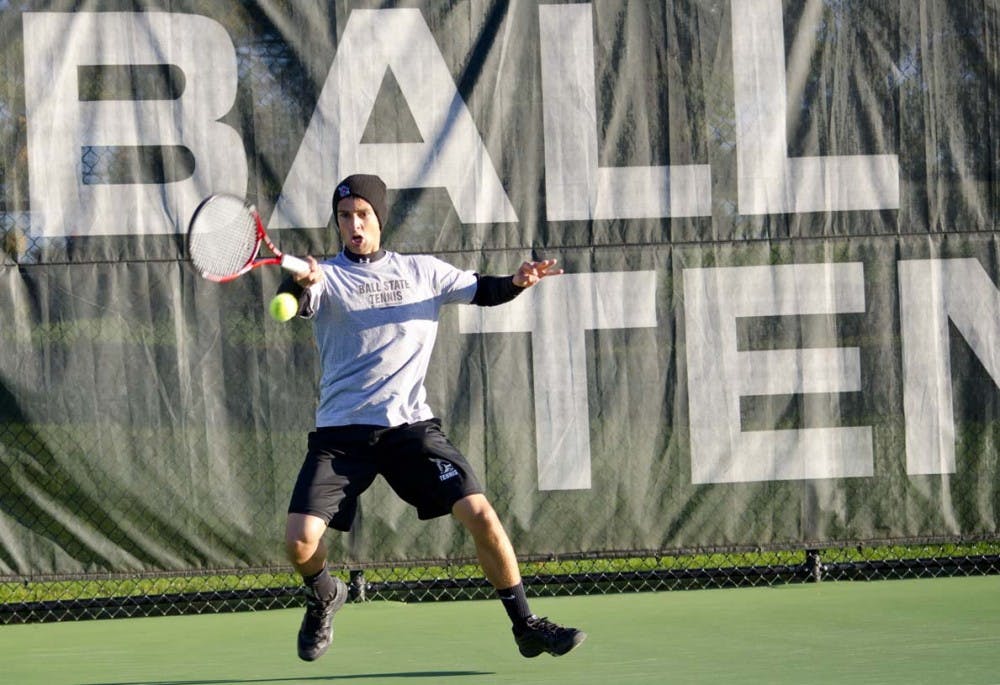 Austin Smith connects on a forehand shot during the Ball State Invitational last year. The men’s tennis team will participate in the Texas University invitational this weekend. DN FILE PHOTO COREY OHLENKAMP