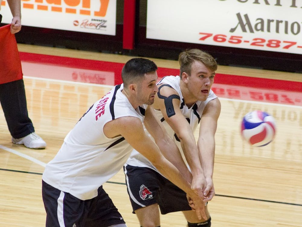 Freshman Blake Reardon and Senior Mike Scannell go for a hit in the Worthen Arena on January 27th. The Cardinals won 3-1 over NJIT.