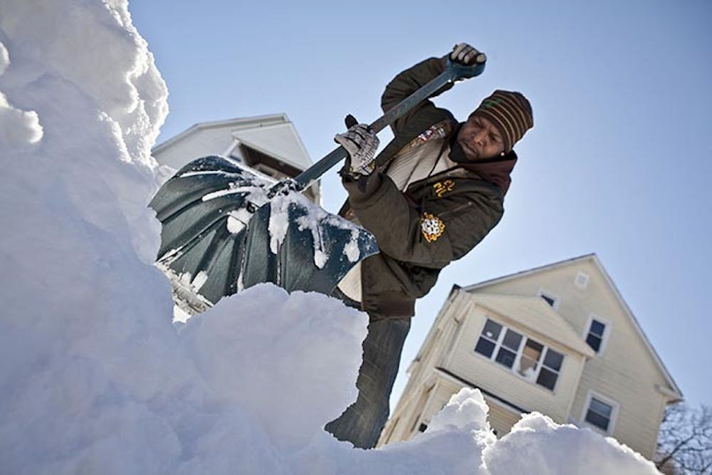 Dex Lawrence clears snow from his driveway in Hartford, Connecticut, Sunday, February 10, 2013. (Johnathon Henninger/Hartford Courant/MCT)