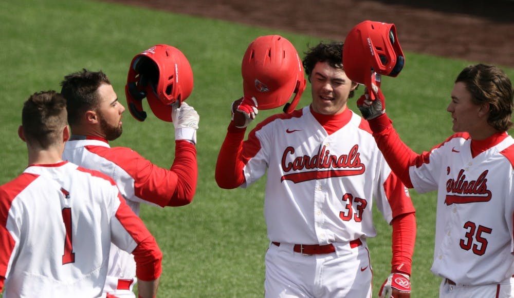 Ball State junior center fielder Aaron Simpson, left, senior first baseman John Ricotta, freshman designated hitter Andre Orselli, and freshman left fielder Mack Murphy celebrate Ricotta's home run in the first during the Cardinals' game against Purdue March 19, 2019 at Ball Diamond at First Merchants Ballpark Complex in Muncie. Ricotta's home run put the Cardinals up 3-0. Paige Grider, DN