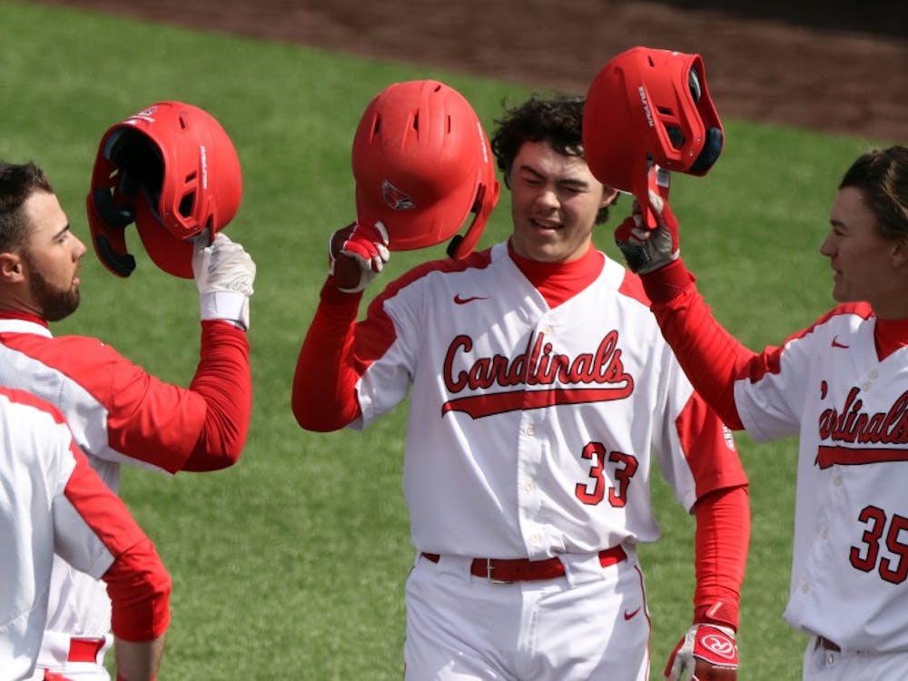 Ball State junior center fielder Aaron Simpson, left, senior first baseman John Ricotta, freshman designated hitter Andre Orselli, and freshman left fielder Mack Murphy celebrate Ricotta's home run in the first during the Cardinals' game against Purdue March 19, 2019 at Ball Diamond at First Merchants Ballpark Complex in Muncie. Ricotta's home run put the Cardinals up 3-0. Paige Grider, DN