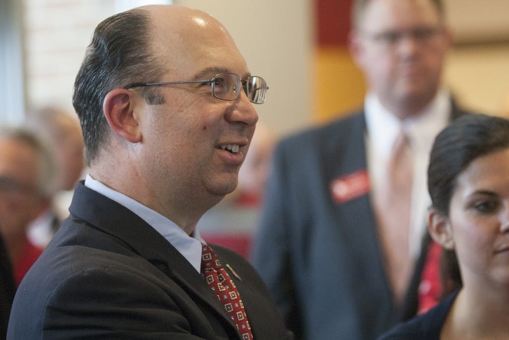 Football head coach Pete Lembo greets people at the groundbreaking ceremony for the Ronald E. and Joan M. Venderly Football Team Complex on June 19. DN PHOTO JORDAN HUFFER