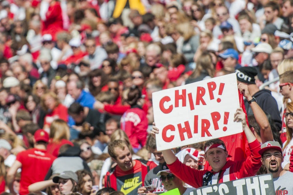 A fan holds up a sign that says "Chirp Chirp" during the game against Indiana State University on Sept. 13 at Scheumann Stadium. The weekend of the 13th was family weekend. DN PHOTO JONATHAN MIKSANEK