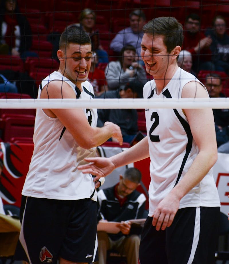 Senior setter Connor Gross and junior middle attacker Anthony Lebryk high five at the game against New Jersey Institute of Technology on Jan. 27 in John E. Worthen Arena. The Cardinals gained a 3-1 win improving to 8-1 this season. Kaiti Sullivan // DN