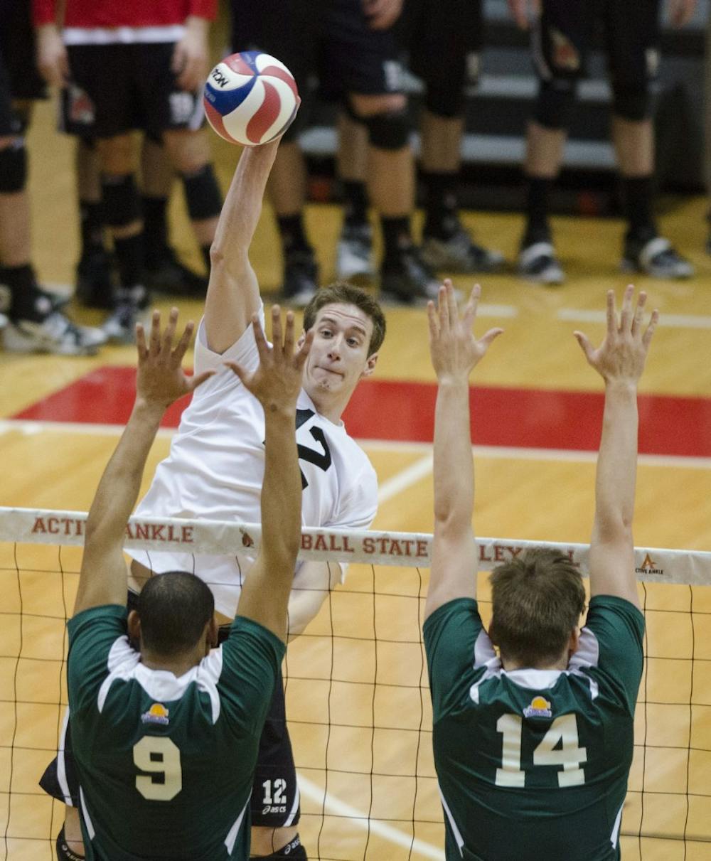Senior outside attacker Matt Sutherland hits the ball over the net in the match against Mount Olive on March 1 at Worthen Arena. The men's volleyball team is 10-5 in their season. DN PHOTO BREANNA DAUGHERTY 
