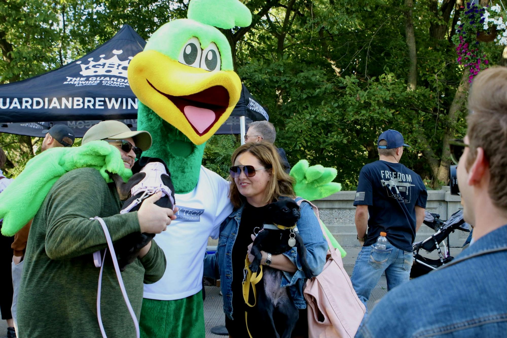 Ivy Tech's mascot, Roadrunner, makes an appearance for some photo shoots with some Muncie locals and their furry friends in Muncie on Thursday, Sept. 22, 2022. Ashton Connelly, DN
