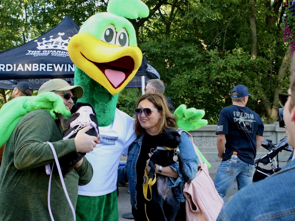 Ivy Tech's mascot, Roadrunner, makes an appearance for some photo shoots with some Muncie locals and their furry friends in Muncie on Thursday, Sept. 22, 2022. Ashton Connelly, DN
