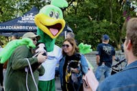 Ivy Tech's mascot, Roadrunner, makes an appearance for some photo shoots with some Muncie locals and their furry friends in Muncie on Thursday, Sept. 22, 2022. Ashton Connelly, DN