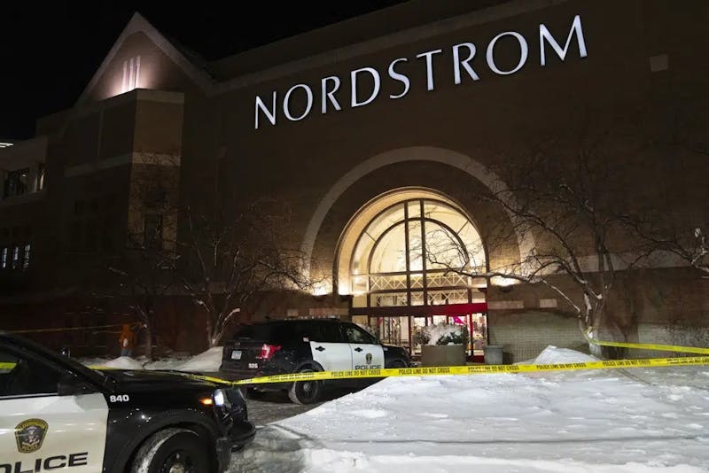 Officials lock down the west wing of the Mall of America after a shooting was reported Friday, Dec. 23, 2022 in Bloomington, Minn. A shooting sent the Mall of America into lockdown Friday evening, mall officials and police in suburban Minneapolis said. (Alex Kormann/Star Tribune via AP)
