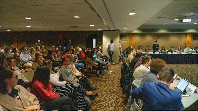 A gallery full of Greek Life members looks on as senator Isaac Mitchell explains the Greek Life Zero Tolerance resolution, which he co-authored. Each speaker was limited to three minutes to speak at a time. John Lynch, DN