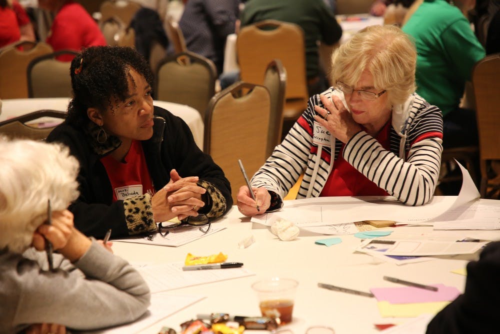 Rep. Sue Errington (D-Muncie) fills out a sheet of paper after those at her table discussed what they want for the future of children at Muncie Community Schools at the "Dreams for Our Schools" event May 21, 2019, in Minnetrista. The notes taken at the event will then inform decisions being made for the academic innovation plan. Rohith Rao, DN
