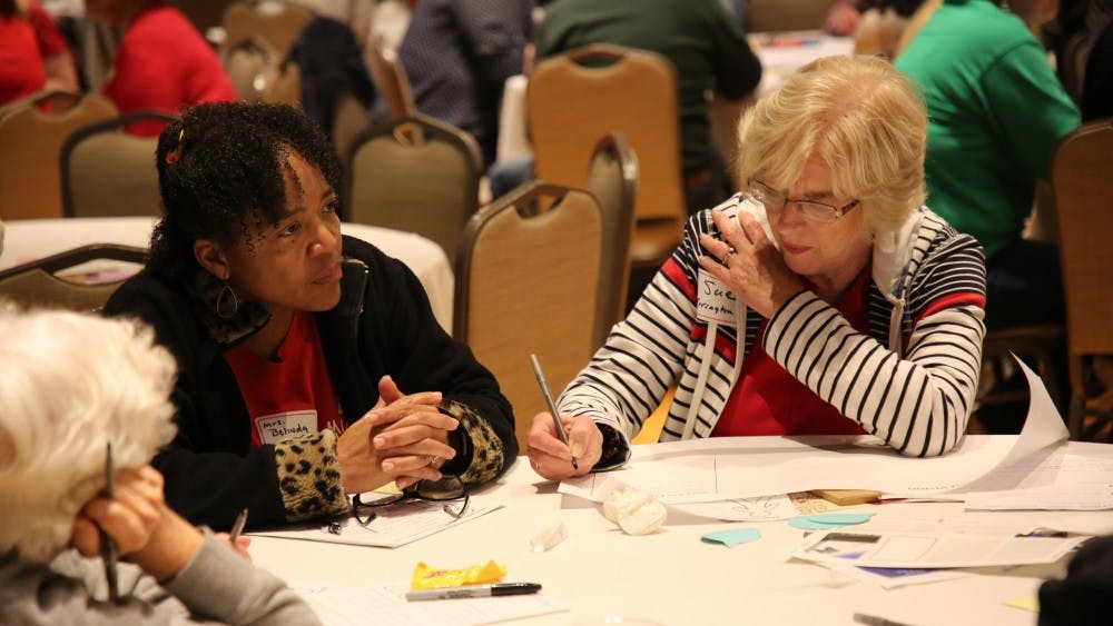 Rep. Sue Errington (D-Muncie) fills out a sheet of paper after those at her table discussed what they want for the future of children at Muncie Community Schools at the "Dreams for Our Schools" event May 21, 2019, in Minnetrista. The notes taken at the event will then inform decisions being made for the academic innovation plan. Rohith Rao, DN