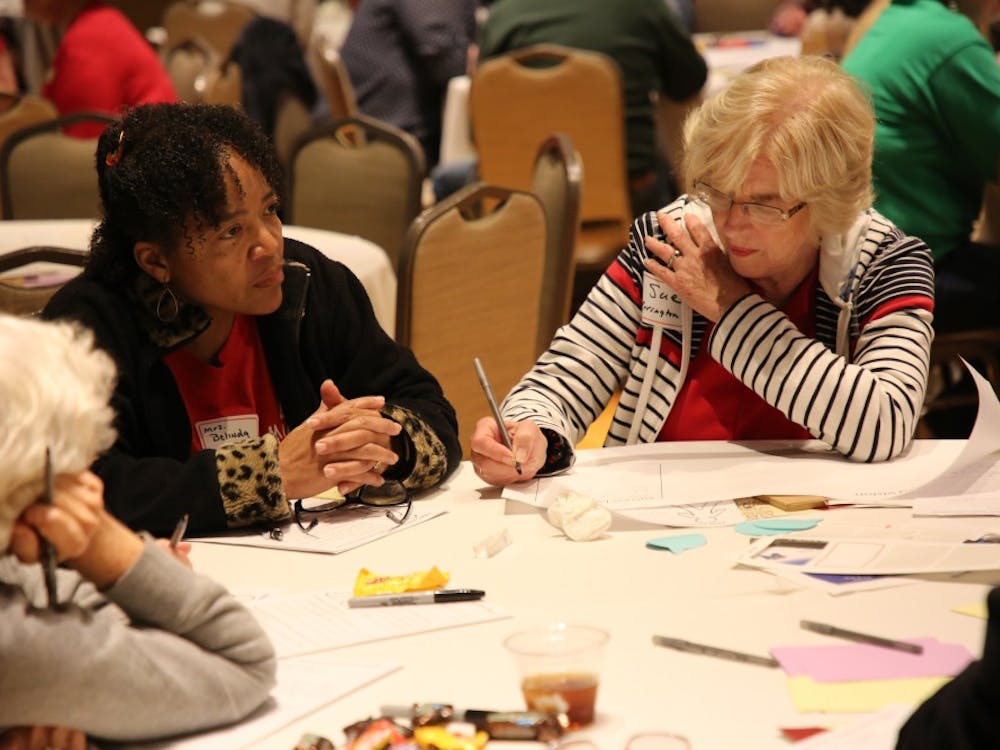 Rep. Sue Errington (D-Muncie) fills out a sheet of paper after those at her table discussed what they want for the future of children at Muncie Community Schools at the "Dreams for Our Schools" event May 21, 2019, in Minnetrista. The notes taken at the event will then inform decisions being made for the academic innovation plan. Rohith Rao, DN