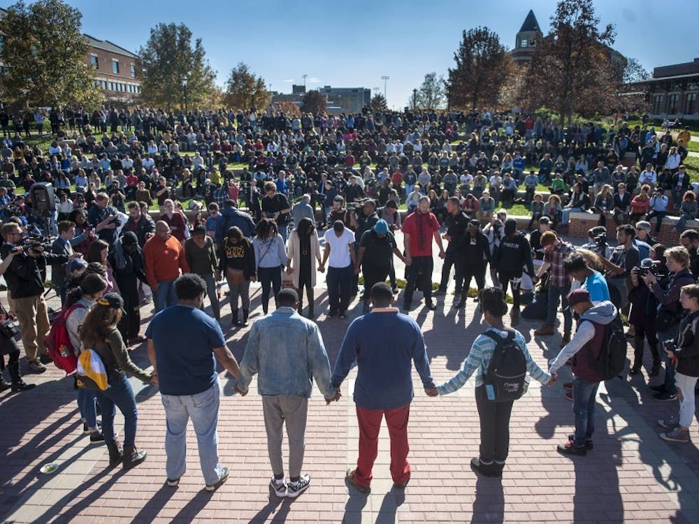 Protesters, students and media fill Traditions Plaza during a press conference following the Concerned Students 1950 protest on Monday, Nov. 9 2015, in Columbia, Mo. (Michael Cali/San Diego Union-Tribune/TNS)