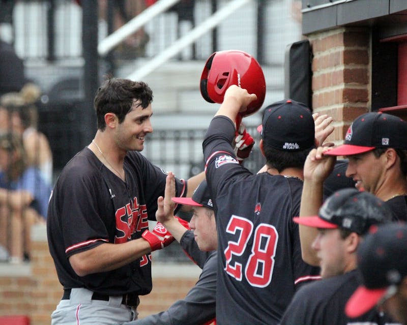 Senior center fielder Matt Eppers celebrates a triple in the eigth during the Cardinals’ game against Bowling Green on April 14 at Ball Diamond at First Merchants Ballpark Complex. Eppers hit scored a runner and put Ball State up 6 to 4. Paige Grider // DN