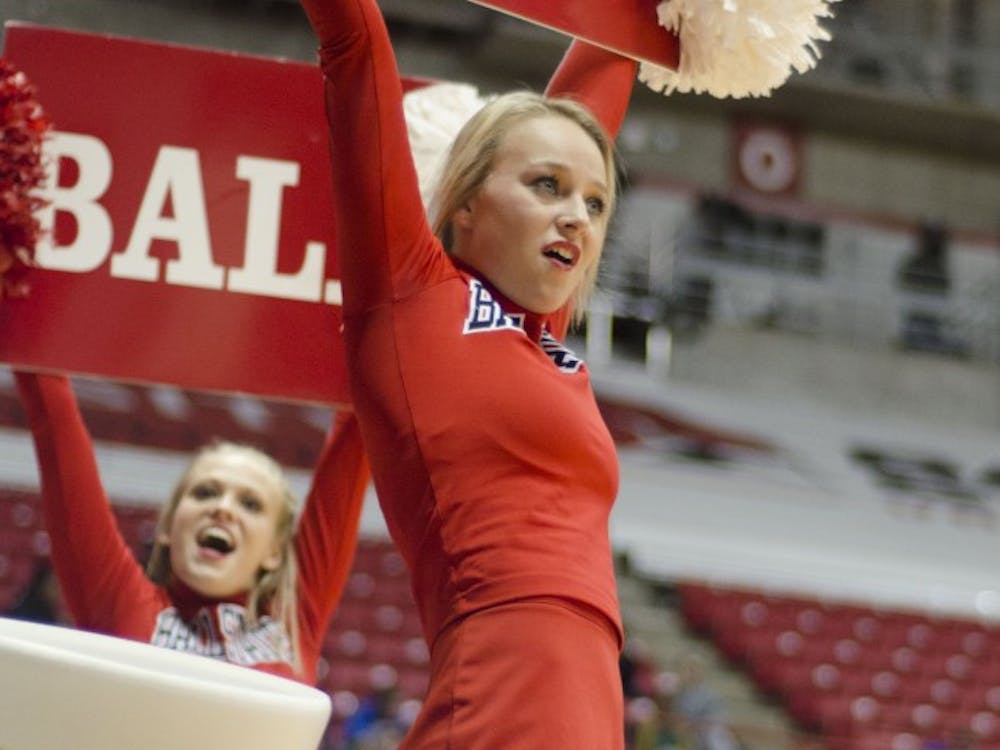 Ball State cheerleaders try to rally the crowd during the men's basketball game against Western Michigan on Feb. 26 at Worthen Arena. DN PHOTO AUDREY ADDINGTON 