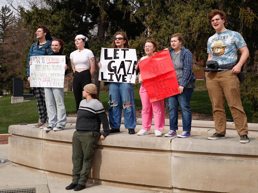 Ball State students protest the war in Palestine March 25 at the Scramble Light. Andrew Berger, DN