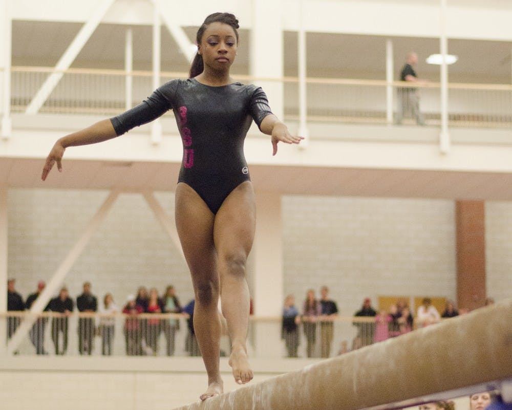 Denaisha Christian performs her routine on the beam during the meet against Western Michigan on Feb. 13 at Irving Gymnasium. DN PHOTO BREANNA DAUGHERTY