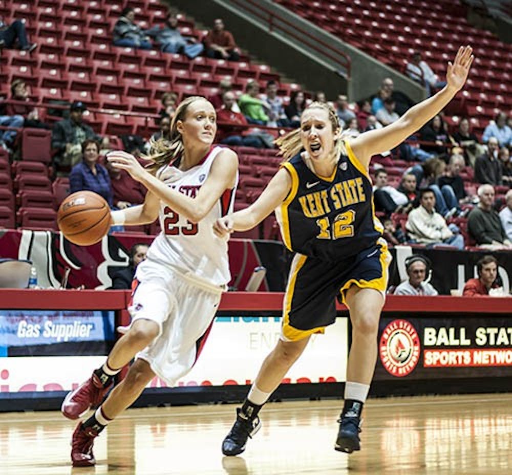 Sophomore guard Brittany Carter attempts to push past Kent State’s Trisha Krewson on Jan. 19, 2013. Ball State beat Eastern Michigan with a 56-41 win, of which Carter made 12 points. DN FILE PHOTO JONATHAN MIKSANEK