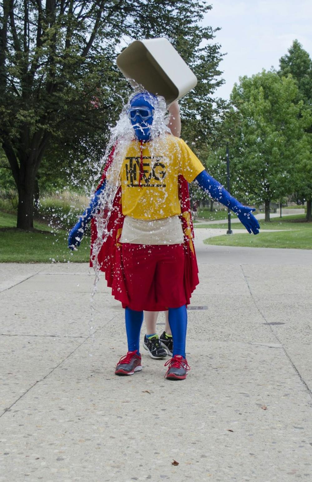 Happy Friday Guy completed the ALS Ice Bucket Challenge on Aug. 29 in front of Bracken Library with the help of Kelley Johnson, a junior theatre major. Happy Friday Guy was challenged by Sad Monday Person. DN PHOTO BREANNA DAUGHERTY 