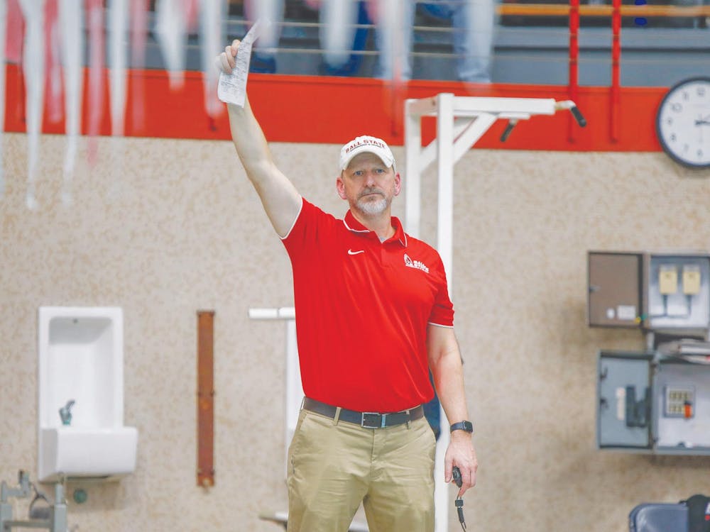 Ball State womens swim and dive head coach J. Agnew watches times come in Jan. 20 against Toledo at Lewellen Aquatic Center. Ball State won 182-117 over Toledo. Andrew Berger, DN