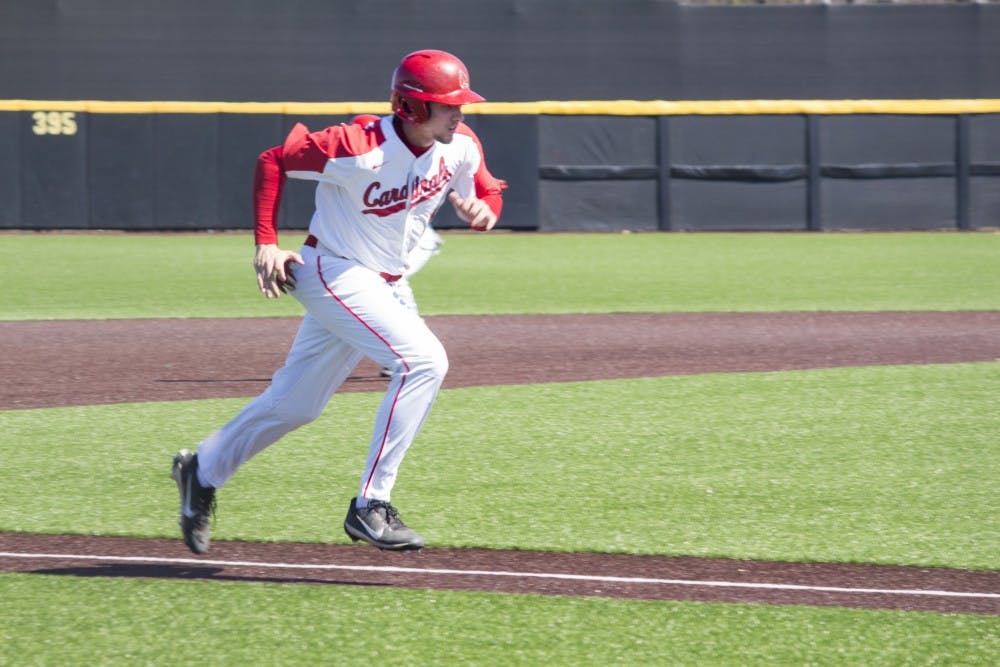 Ball State baseball player Rhett Wintner runs home during the game against the University of Dayton on March 18 at the Baseball Diamond at First Merchant’s Ballpark Complex. Dayton got the third out during the play, so the run did not count. Briana Hale, DN