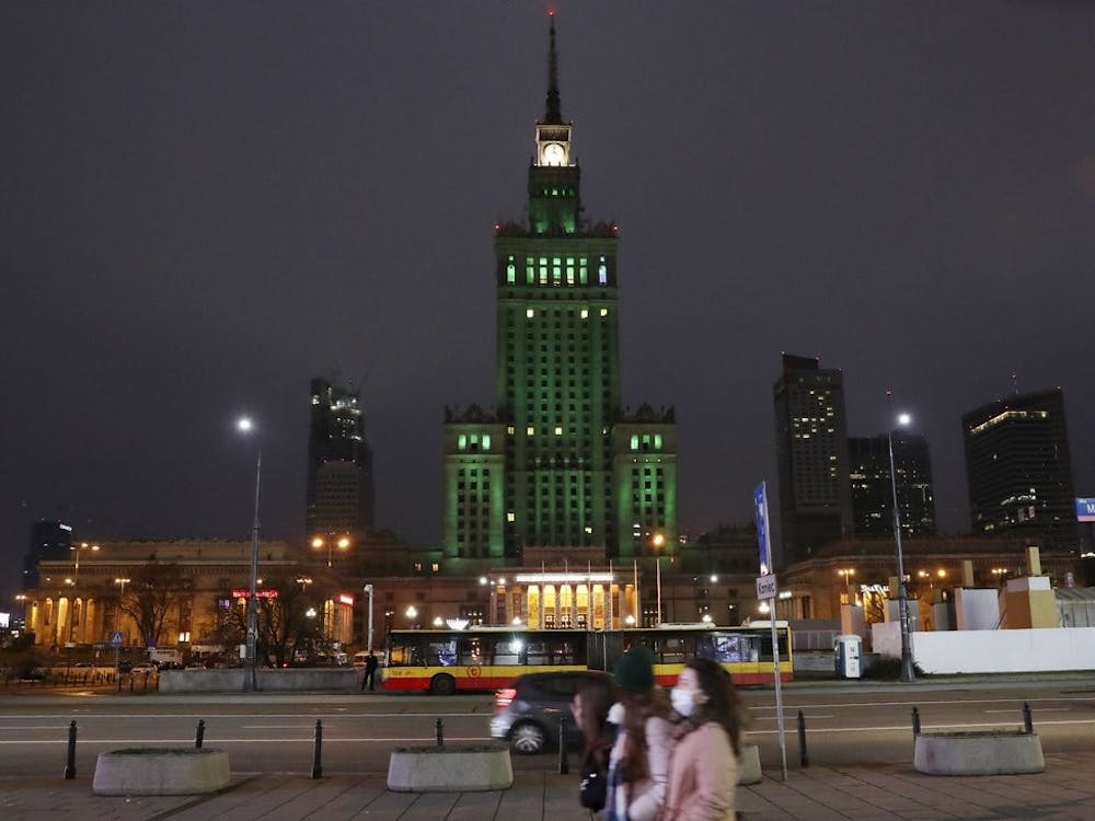 The iconic Palace of Culture in the Polish capital Warsaw, Poland, Saturday, Dec. 12, 2020, is lit green to mark the 5th anniversary of the Paris climate accord. (AP Photo/Czarek Sokolowski)
