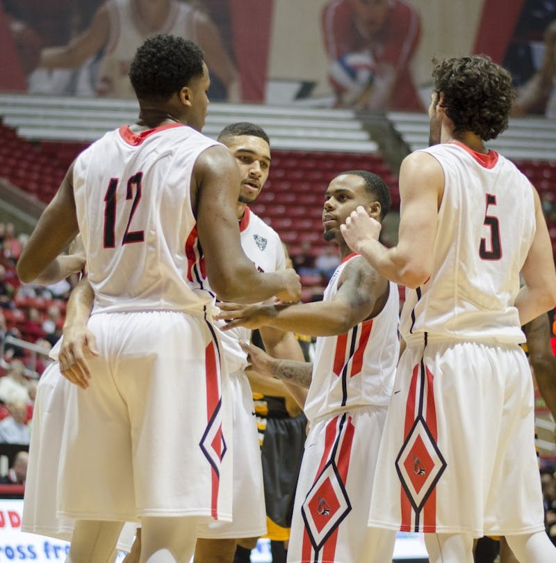 Members of the men's basketball team huddle up after a foul was called during the game against Kent State on Jan. 24 at Worthen Arena. DN PHOTO BREANNA DAUGHERTY