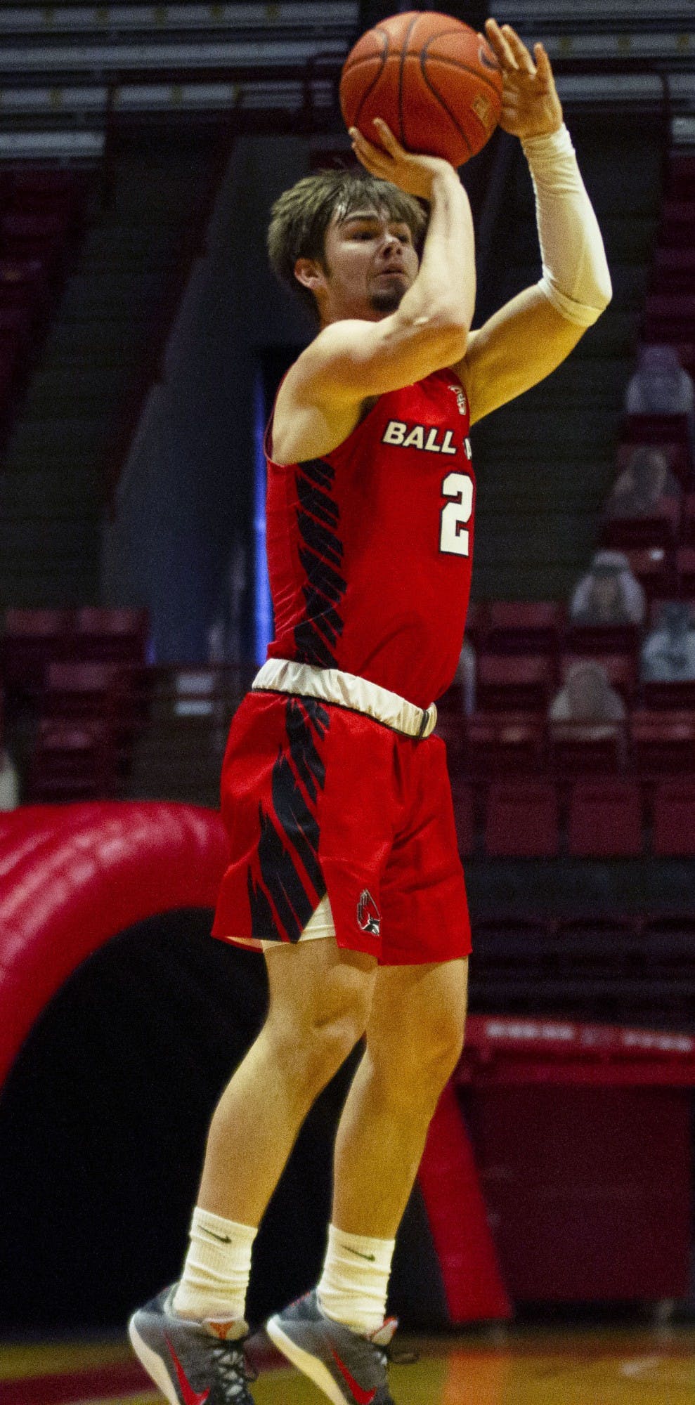 Sophomore guard Luke Bumbalough shoots a three point shot Feb. 27, 2021, in John E. Worthen Arena. The Cardinals won 97-91 against the Chippewas. Grace Walton, DN