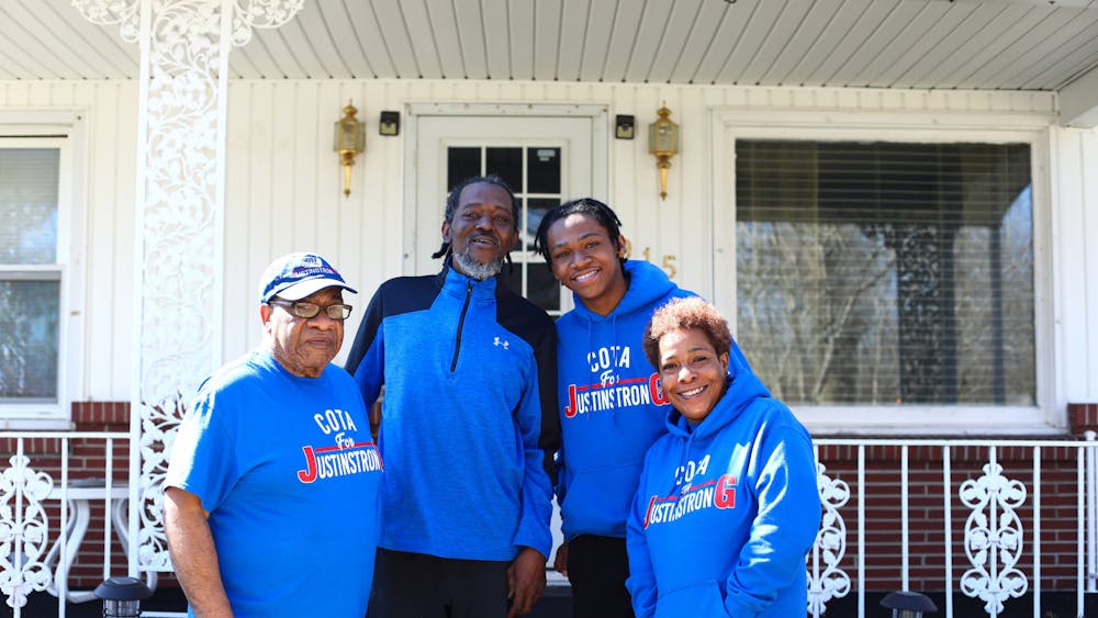Gary Mason, Robert Gillespie III, Justin Gillespie and Garnisha Mason (left to right) pose for a portrait March 15 on the porch of Garnisha's home in Muncie, Ind. Justin and his family are waiting for a kidney transplant, after Justin's diagnosis of nephrotic syndrome in May of 2021. Jacy Bradley, DN