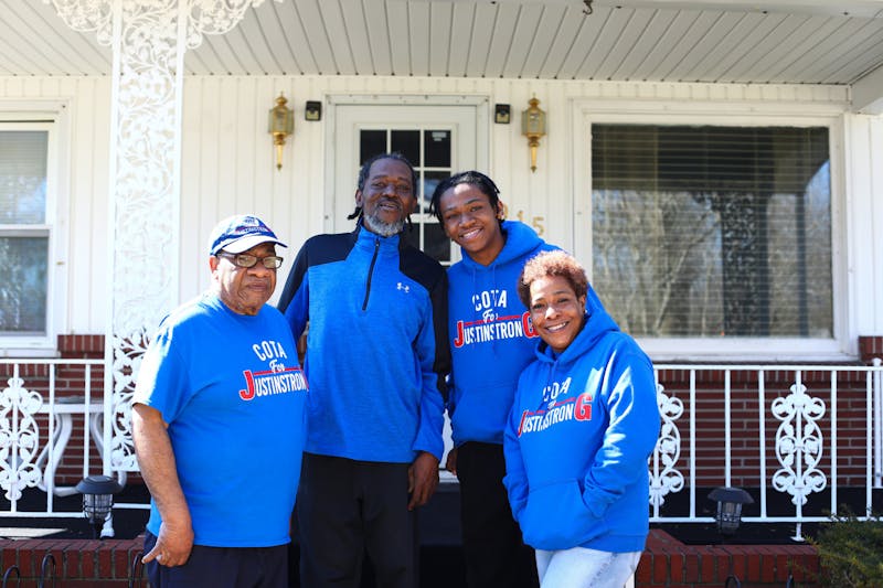 Gary Mason, Robert Gillespie III, Justin Gillespie and Garnisha Mason (left to right) pose for a portrait March 15 on the porch of Garnisha's home in Muncie, Ind. Justin and his family are waiting for a kidney transplant, after Justin's diagnosis of nephrotic syndrome in May of 2021. Jacy Bradley, DN