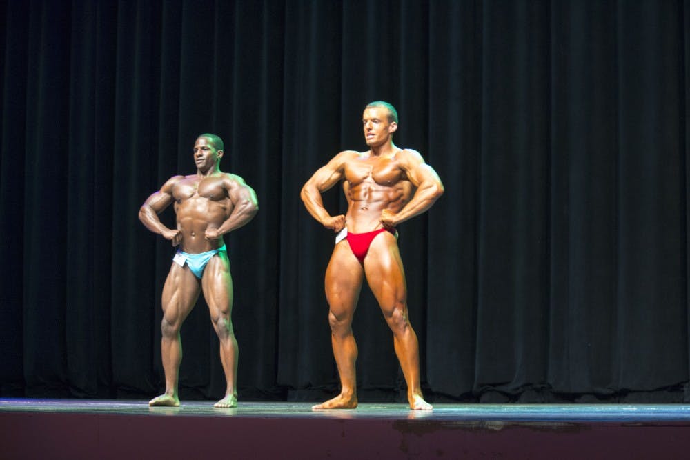 Corey Nelson and Ryan Bickford pose head-to-head, after winning first place in their divisions, to compete for Mr. Bodybuilding Ball State 2016. Twenty students participated in the annual the Mr. and Ms. Bodybuilding Ball State on April 14 in John R. Emens Auditorium. DN PHOTO MAGGIE KENWORTHY