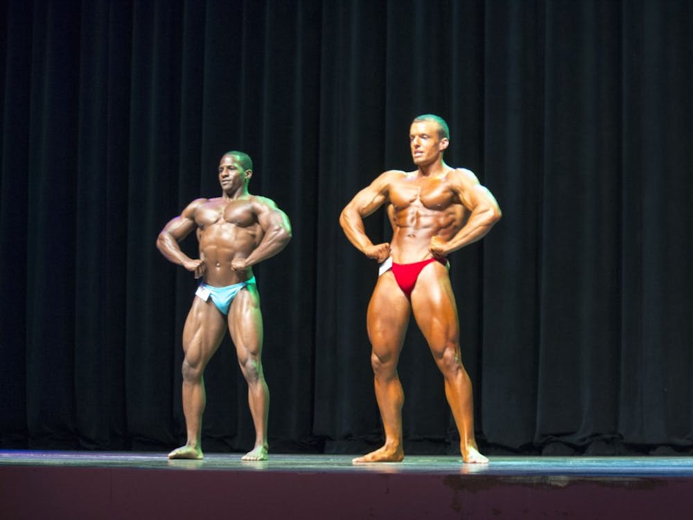 Corey Nelson and Ryan Bickford pose head-to-head, after winning first place in their divisions, to compete for Mr. Bodybuilding Ball State 2016. Twenty students participated in the annual the Mr. and Ms. Bodybuilding Ball State on April 14 in John R. Emens Auditorium. DN PHOTO MAGGIE KENWORTHY