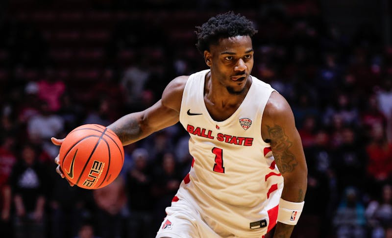 Ball State junior guard Jermarhi Hill dribbles the ball against Miami Jan. 1 at Worthen Arena. Hill had 20 points in the game. Andrew Berger, DN 