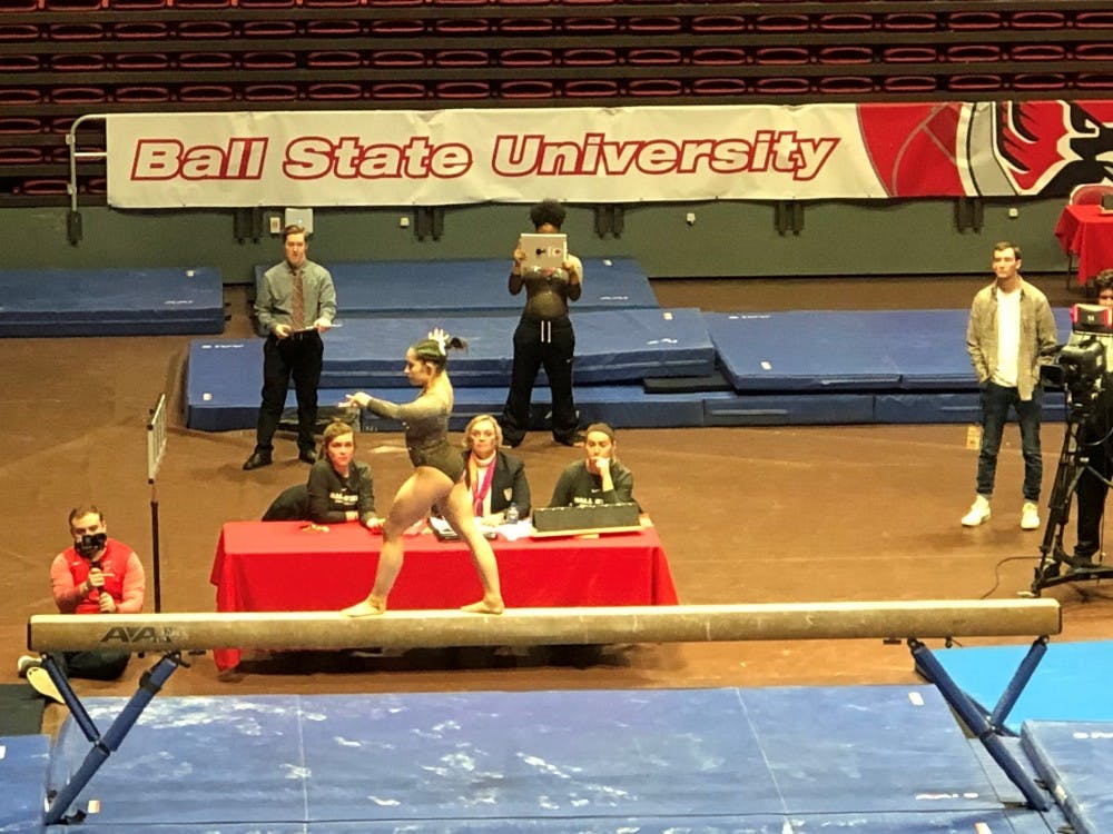 Senior Kaitlyn Menzione participates in the beam event in Worthen Arena Feb. 17, 2019, against Northern Illinois. The Cardinals fell to the Huskies, 195.700-194.700. Drew Pierce, DN