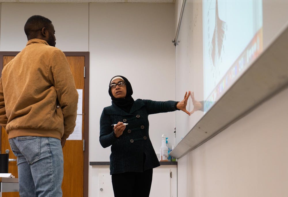 Professor Munni Begum has a student demonstrate what they are learning during her Monday evening class Dec. 2 in Robert Bell. Begum encourages all of her students to stay in contact after graduation. Isabella Kemper, DN