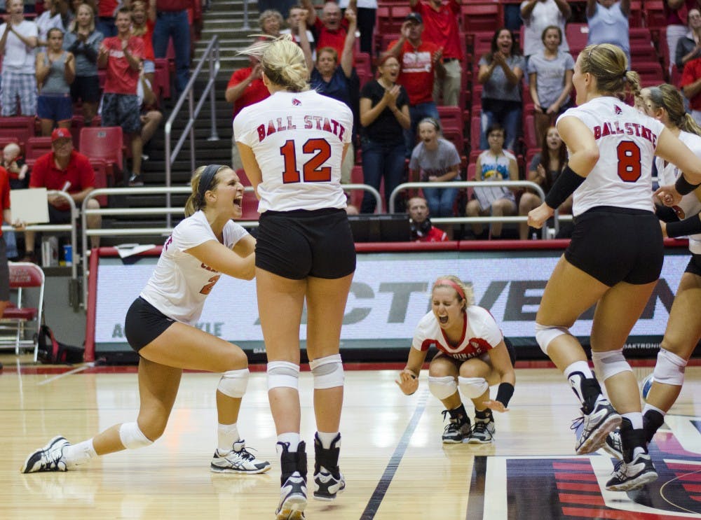 Members of the women's volleyball team celebrate after winning the match in the second game of the Active Ankle Tournament against Belmont on Aug. 28 at Worthen Arena. DN PHOTO BREANNA DAUGHERTY