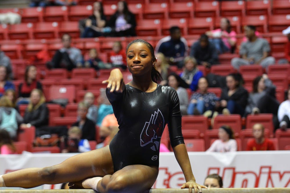 Senior Denasiha Christian performs her routine on the beam during the meet against Illinois State and Eastern Michigan on Jan. 24 at Worthen Arena. DN PHOTO KORINA VALENZUELA 