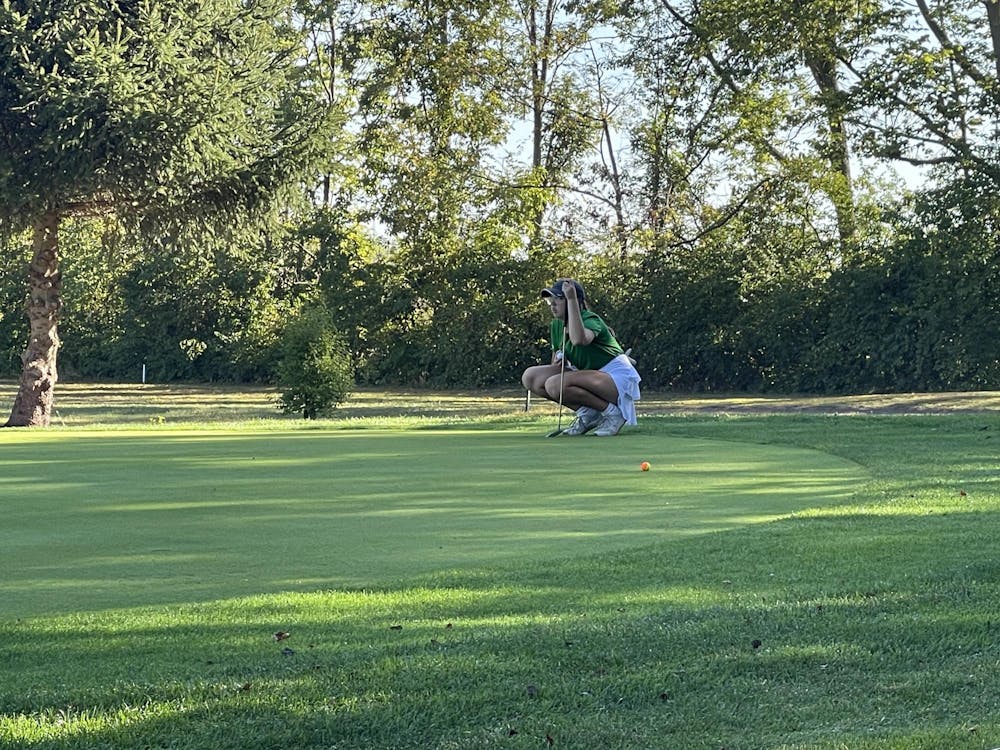 <p>Grace Turner, junior, lines up her birdie putt on the fifth hole at Crestview Golf Club. Turner’s birdie helped place her tied ninth and the Tigers to a 3rd place finish at the sectional championship. Photo by: Landon Case.</p>