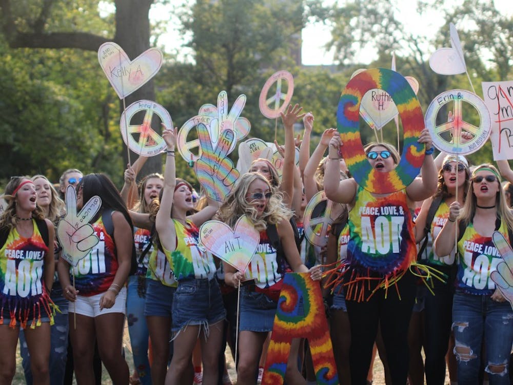 A group of Alpha Omicron Pis cheer together during Bid Day on the Quad on Sept. 10. Bid Day is where sororities accept their pledges and reunite with their Phi Chis. Cassidy Knowling, DN