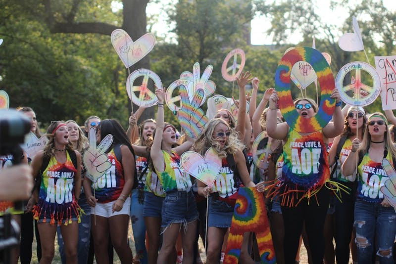 A group of Alpha Omicron Pis cheer together during Bid Day on the Quad on Sept. 10. Bid Day is where sororities accept their pledges and reunite with their Phi Chis. Cassidy Knowling, DN