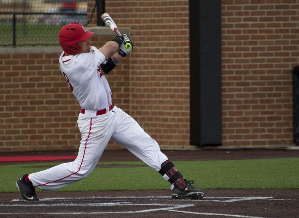 Alex Call, a junior outfielder for the Ball State Cardinals, attempts to hit the ball in the game against Ohio on April 1. DN PHOTO GRACE RAMEY